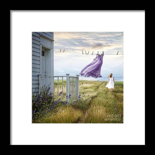 Summer dress blowing on clothesline with girl walking down path #3 Framed Print