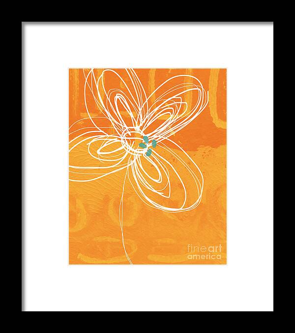 White Flower on Orange Framed Print